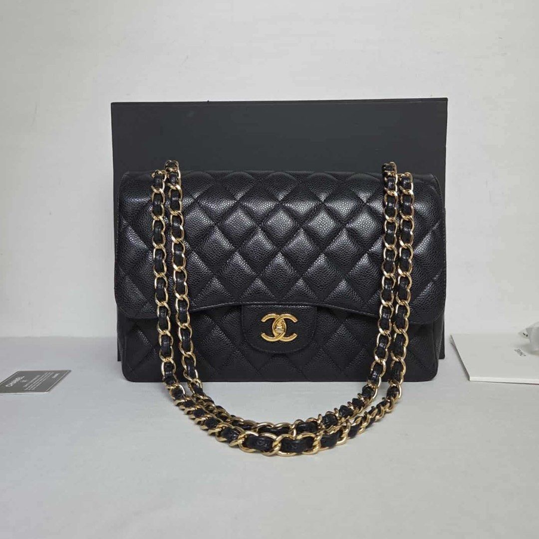 Chanel Classic Flap Bag Black Caviar Leather (Category: Luxury Bags & Wallets) located in Quezon City. Submitted by dhexyoblepias (Listing ID 1431592679, Image 1). Description: - Authentic Chanel Classic Flap bag - Black caviar leather - Diamond-quilted exterior - Signature CC turn-lock closure - Chain-and-leather strap - Burgundy leather interior - Multiple compartments - Includes box and authenticity card.