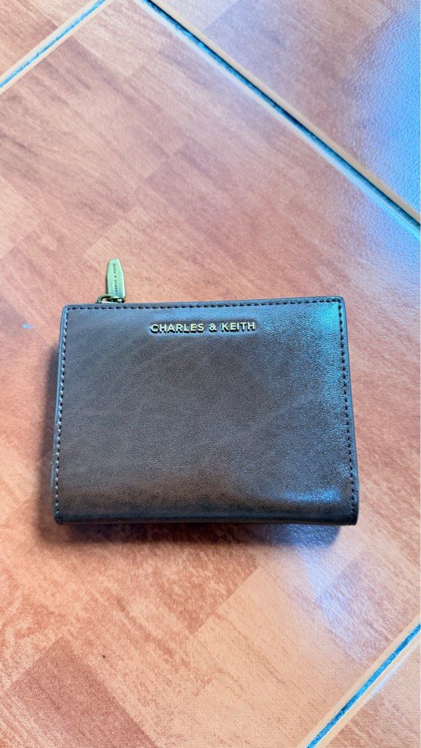 Charles & Keith Finley Zip-Around Small Wallet (Category: Wallets & Card holders) located in Makati City. Submitted by assorted_items88 (Listing ID 1431594859, Image 1). Description: 👛 FOR SALE: Charles & Keith Finley Zip-Around Small Wallet (Dark Brown) ✔️ Original Charles & Keith ✔️ NEVER USED (stored only) ✔️ Like brand new condition ✔️ Compact but spacious (cards, cash, coins) ✔️ Zip-around + snap closure Condition: 10/10 – no issues RFS: De