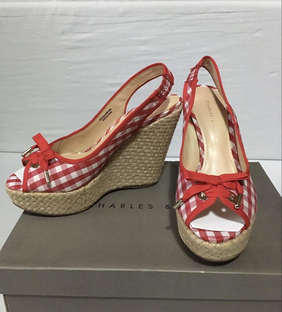 Charles & Keith Red Gingham Wedges (Category: Wedges) located in Quezon City. Submitted by limebasil (Listing ID 1431672663, Image 2). Description: - Charles & Keith wedges - Red and white gingham pattern - Open-toe design - Slingback style - Features a bow detail - Woven soles - Includes original box.