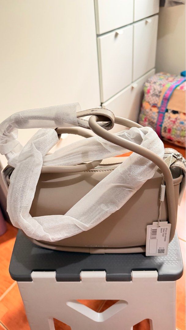 Charles & Keith Shoulder Bag (Category: Shoulder Bags) located in Makati City. Submitted by assorted_items88 (Listing ID 1431602841, Image 3). Description: 🤍 FOR SALE: Charles & Keith Shoulder Bag (Taupe) ✔️ Brand new (with tag & plastic intact) ✔️ Elegant taupe color – neutral & easy to match ✔️ Adjustable strap (shoulder / crossbody) ✔️ Compact but spacious for essentials 💰 SRP: ₱4,199 💸 Selling Price: 3,500.00 RFS: Decluttering .