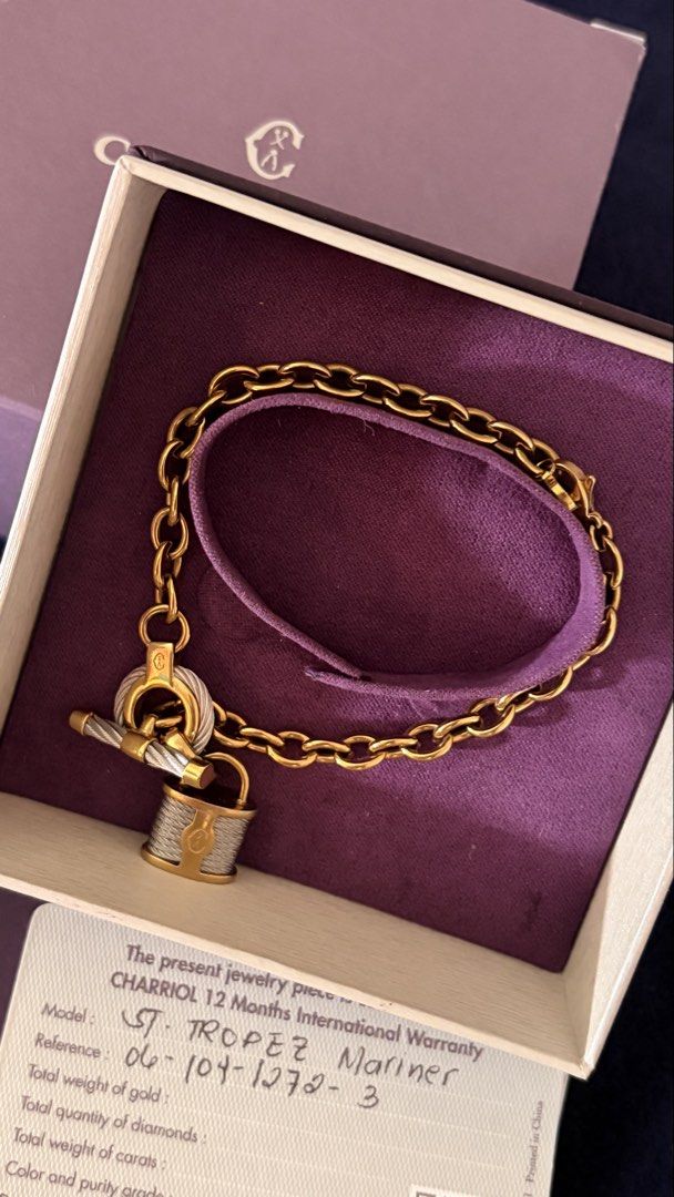 Charriol St. Tropez Mariner Bracelet (Category: Bracelets) located in Mandaluyong City. Submitted by prelovedcole (Listing ID 1431575733, Image 2). Description: - Authentic Charriol St. Tropez Mariner bracelet - Gold chain with purple leather strap - Features lock charm and T-bar closure - Includes original box, warranty card, and papers, and Paperbag Bought at Charriol Gh mall Retails around 20k .
