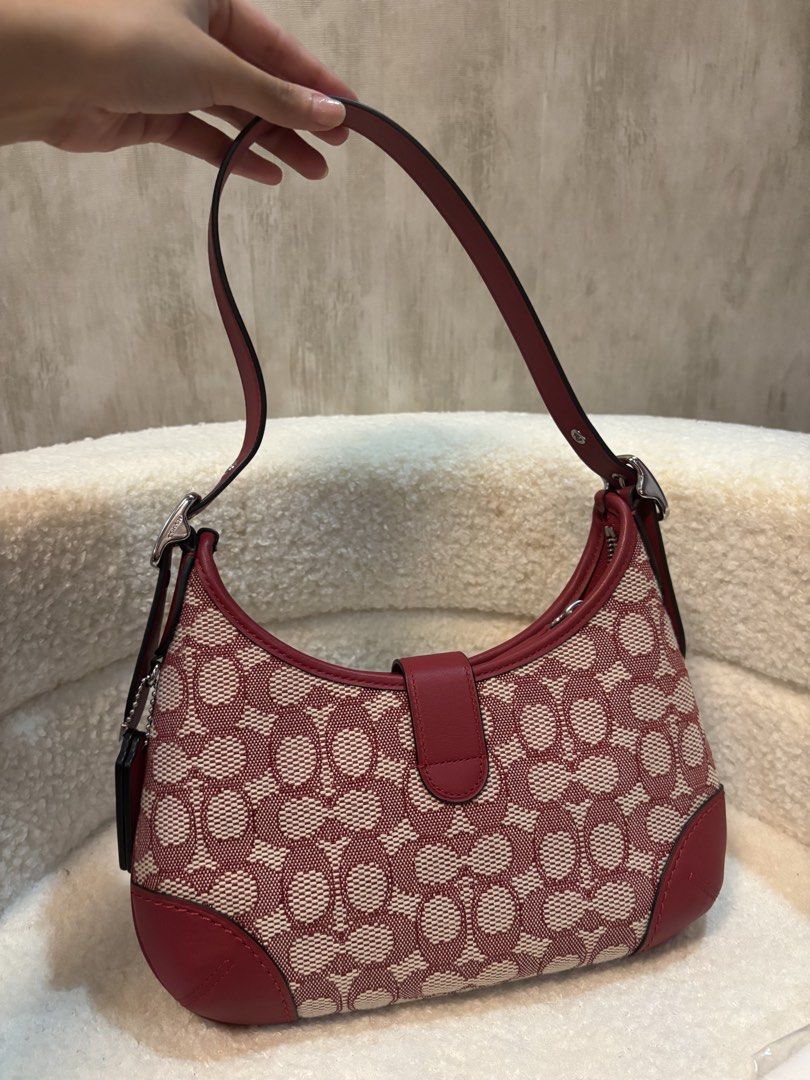 Coach Hampton Hobo Shoulder Bag (Category: Luxury Bags & Wallets) located in Manila. Submitted by _thepursela (Listing ID 1431716008, Image 3). Description: - Coach Hampton Hobo shoulder bag - Color: Red and beige - Features signature Coach pattern - Top handle - Flap closure with silver-tone clasp - Includes dust bag and hang tags - Interior zip closure - Leather tag with Coach logo - Limited re-edition 2003.