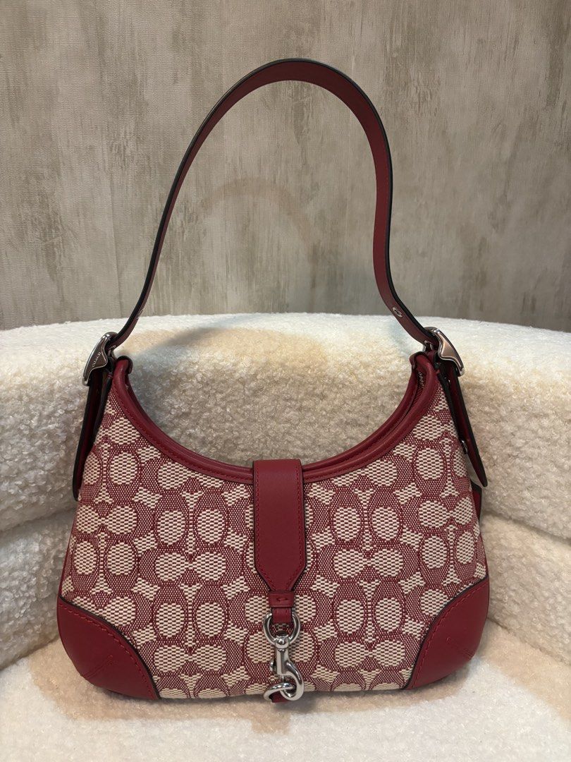 Coach Hampton Hobo Shoulder Bag (Category: Luxury Bags & Wallets) located in Manila. Submitted by _thepursela (Listing ID 1431716008, Image 2). Description: - Coach Hampton Hobo shoulder bag - Color: Red and beige - Features signature Coach pattern - Top handle - Flap closure with silver-tone clasp - Includes dust bag and hang tags - Interior zip closure - Leather tag with Coach logo - Limited re-edition 2003.