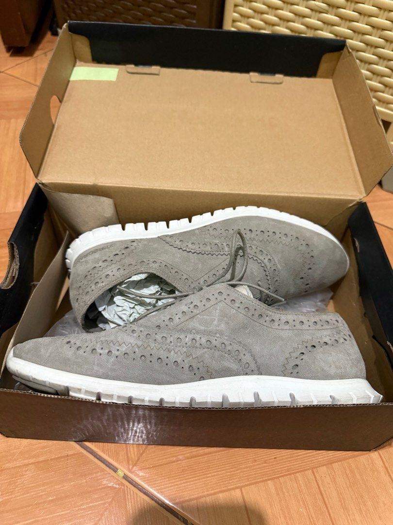 Cole Haan Zerogrand Wngox CII (Category: Sneakers) located in Antipolo. Submitted by epicpenguin-3c070e (Listing ID 1431764324, Image 3). Description: - Cole Haan Zerogrand Wingox CII - Color: Ironstone (Gray) - Size: 8B - Classic wingtip design - Gray suede upper - White soles - Perforated detailing - Original box included.
