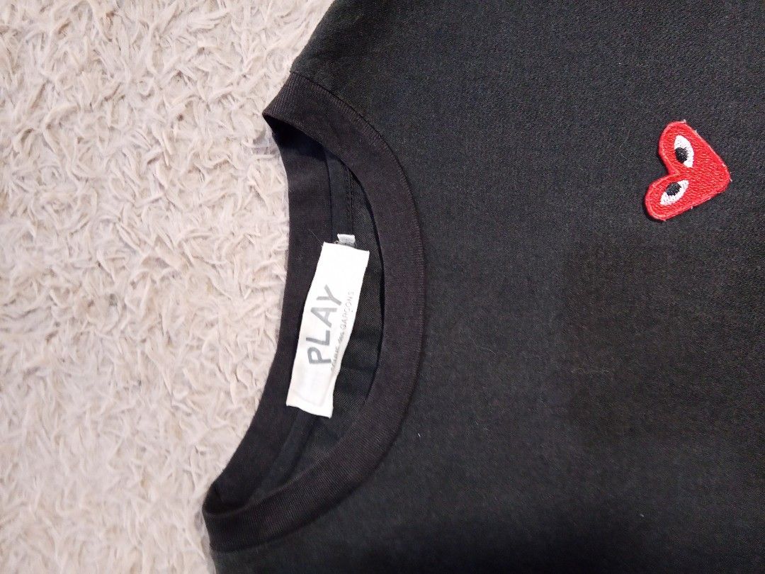 Comme des Garcons Play Heart T-shirt (Category: Shirts) located in Lucban. Submitted by aeronroyyy (Listing ID 1431663619, Image 2). Description: - Comme des Garcons Play t-shirt - Iconic heart logo design - Small heart on chest - Large heart on lower left - Crew neck - Short sleeves - Brand new with tag.