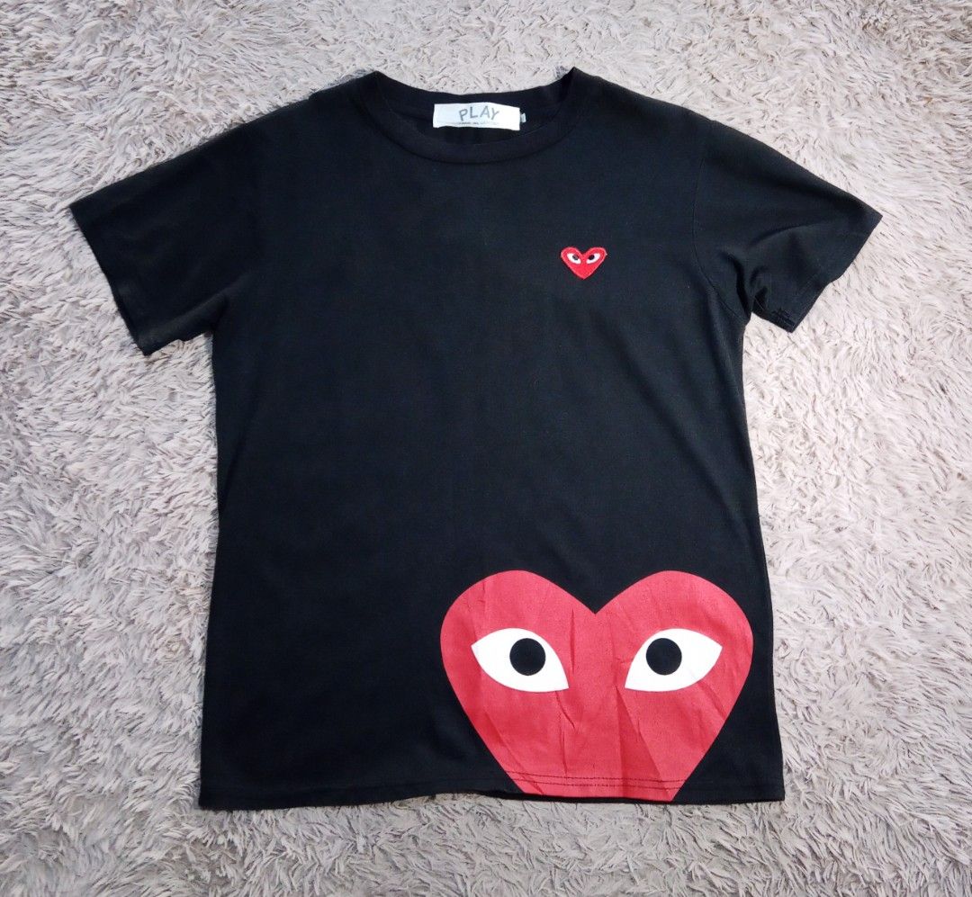 Comme des Garcons Play Heart T-shirt (Category: Shirts) located in Lucban. Submitted by aeronroyyy (Listing ID 1431663619, Image 1). Description: - Comme des Garcons Play t-shirt - Iconic heart logo design - Small heart on chest - Large heart on lower left - Crew neck - Short sleeves - Brand new with tag.