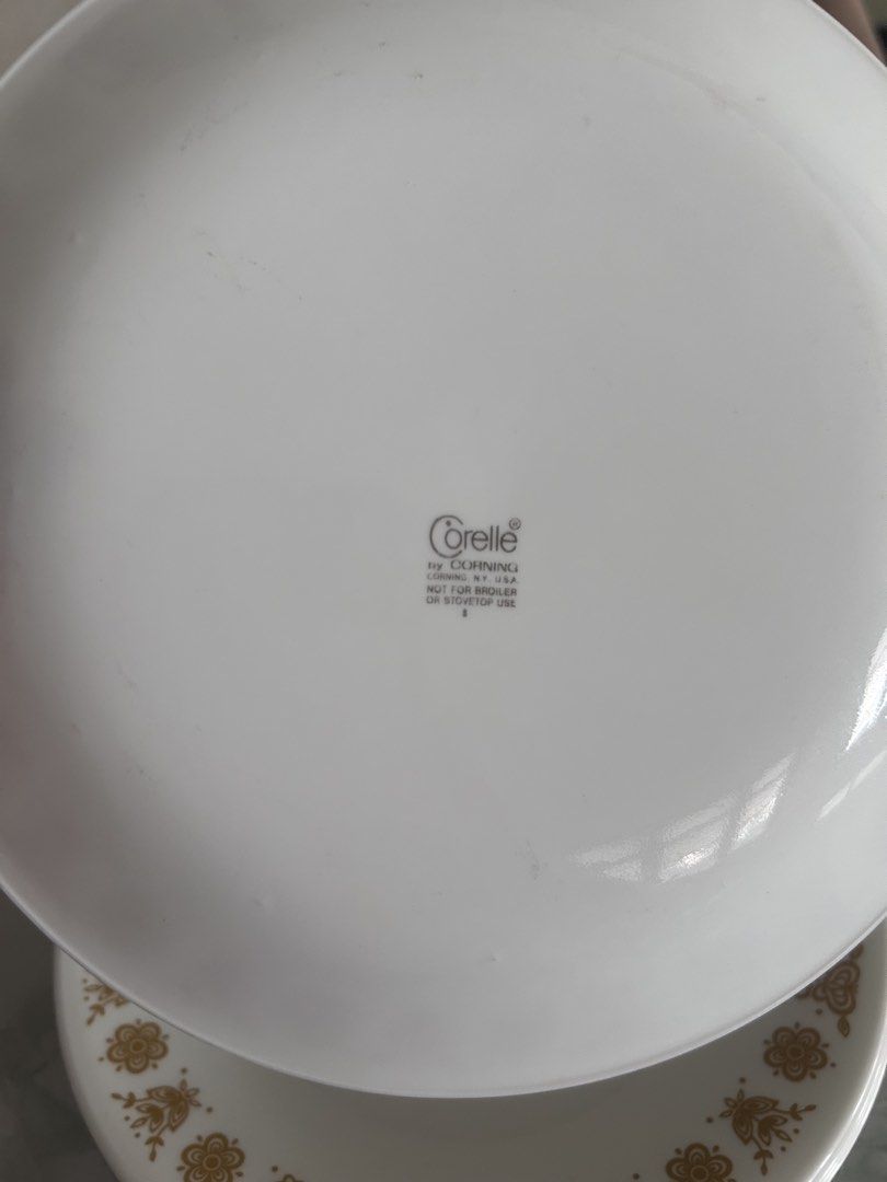 Corelle Dinner Plates with Floral Design 450 each (Category: Dinnerware & Cutlery) located in Lubao. Submitted by appleglaze (Listing ID 1431621928, Image 2). Description: - Corelle dinner plates - White with gold floral pattern - Lightweight and durable - Perfect for everyday use or special occasions - Corelle logo visible.