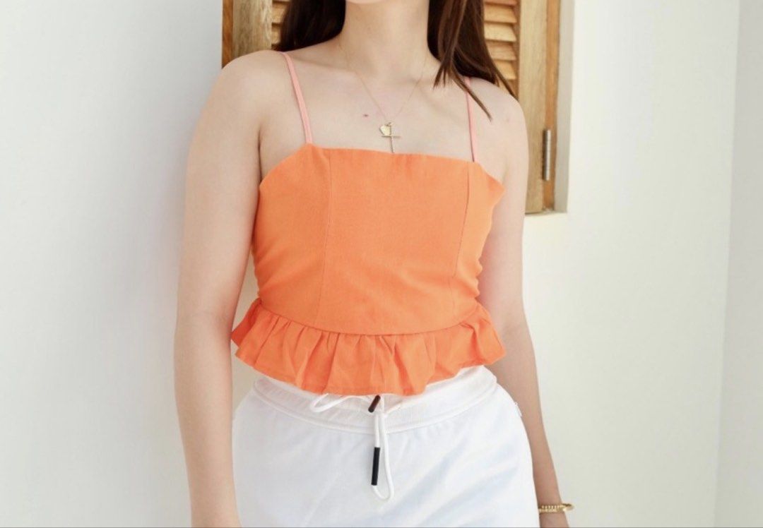 Cotton On Crop Top Stretchy Back and Adjustable Straps (Category: Sleeveless) located in Manila. Submitted by shee_decluttering (Listing ID 1431616646, Image 3). Description: Worn only twice maybe thrice Not into crop tops anymore Last photo is inspo when worn only Size is XS and in color orange.
