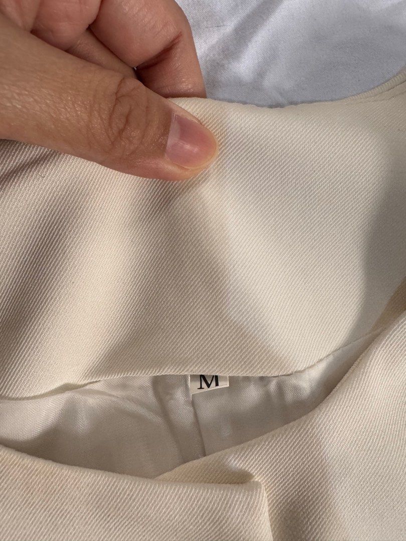 Cream-colored Vest with Buttons - Size M (Category: Sleeveless) located in Manila. Submitted by raphaelain17296 (Listing ID 1431732902, Image 3). Description: - Cream-colored vest - Size Semi large - Round neckline - Two front pockets - Decorative buttons - Visible lining.