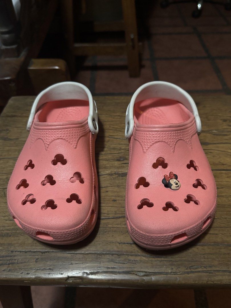 Crocs Disney Minnie Mouse Clogs - Size M3 /W5 (Category: Babies & Kids Fashion) located in Quezon City. Submitted by limebasil (Listing ID 1431738077, Image 1). Description: - Pink Crocs clogs - Adorned with a Minnie Mouse charm - White strap - Size: M3/W5 - Features Mickey Mouse-shaped holes - Crocs logo visible - Made in China.