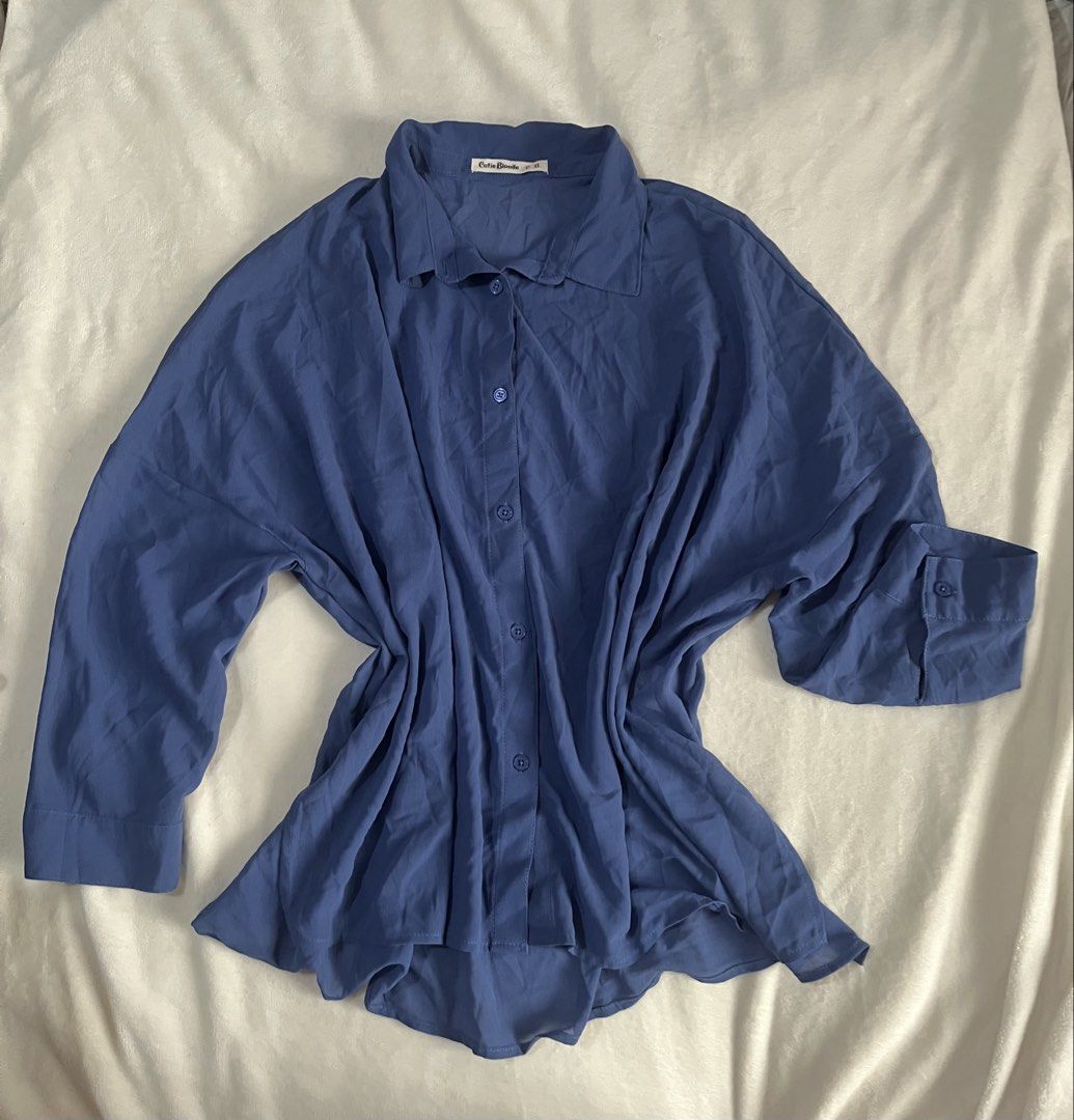 Cutie Blonde Blue Blouse Longsleeves (Category: Blouses) located in Mandaluyong City. Submitted by mandmclosey_ (Listing ID 1431659019, Image 2). Description: - Cutie Blonde blue blouse - Collared neckline - Button-down closure - Long sleeves with buttoned cuffs - Measurements: - Length: 25 inches - Width: 26 inches - Sleeves: 14 inches - Lightweight material - Suitable for casual and semi-formal occasions Loc: Mandaluyong City Mode of payment: G