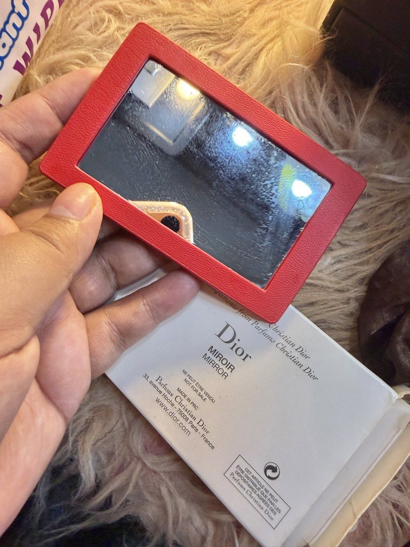 Dior Compact Mirror (Category: Mirrors) located in Bacoor. Submitted by peanut_storm (Listing ID 1431727121, Image 2). Description: - Authentic Dior compact mirror - Red leather exterior with CD logo - Includes original box - Made in France - Perfect for touch-ups.