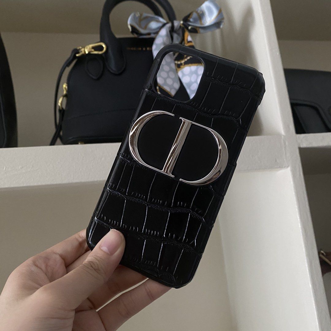 Dior Mirror Phone Stand and iPhone 11 Pro Leather Case (Category: Cases & Sleeves) located in Manila. Submitted by pippintook (Listing ID 1431584435, Image 1). Description: - Really free - iPhone 11 pro leather case is free too. - I haven’t tried detaching mirror from case, but it looks like kaya naman then reapply double sided tape nalang if want ilipat to another phone case. - Not sure if can be fixed, but minor flaw can be seen in last picture