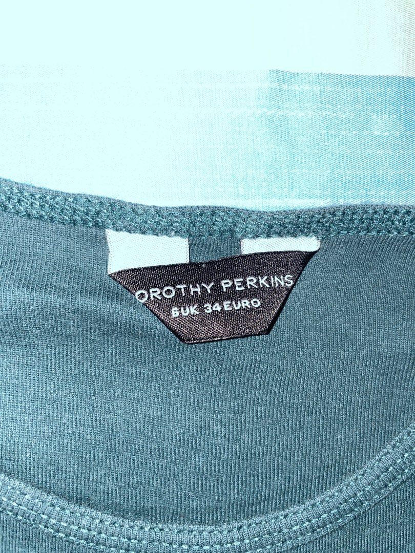 Dorothy Perkins Long Sleeve Top (Category: Blouses) located in Quezon City. Submitted by prebyv (Listing ID 1431734672, Image 2). Description: - Dorothy Perkins teal long sleeve top - Round neckline - UK size 34 - Slim fit - Soft, comfortable fabric - Versatile for layering.