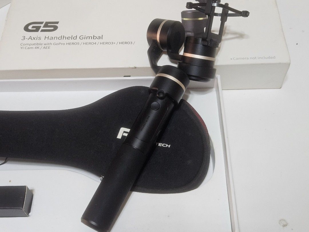 FeiyuTech G5 3-Axis Handheld Gimbal (Category: Gimbals & Stabilizers ) located in Las Pinas. Submitted by jcprillo0508 (Listing ID 1431788673, Image 3). Description: - FeiyuTech G5 3-Axis Handheld Gimbal - Compatible with GoPro HERO4/HERO3+/HERO3 and Yi Cam 4K/4K+ - Comes with a carrying case - Includes a small accessory box - Stylish black and gold color - Box image shows gimbal with camera mounted.