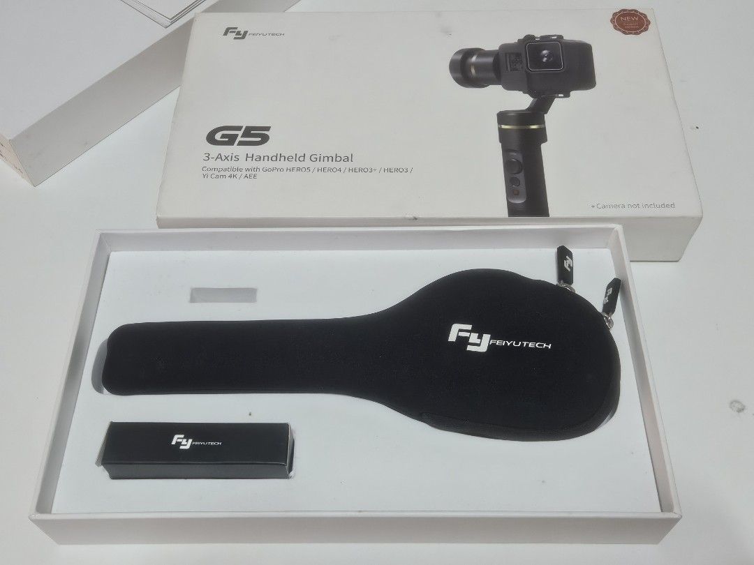 FeiyuTech G5 3-Axis Handheld Gimbal (Category: Gimbals & Stabilizers ) located in Las Pinas. Submitted by jcprillo0508 (Listing ID 1431788673, Image 1). Description: - FeiyuTech G5 3-Axis Handheld Gimbal - Compatible with GoPro HERO4/HERO3+/HERO3 and Yi Cam 4K/4K+ - Comes with a carrying case - Includes a small accessory box - Stylish black and gold color - Box image shows gimbal with camera mounted.