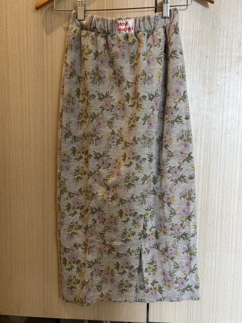 Floral Print Midi Skirt (Category: Skirts) located in Cainta. Submitted by kayeshoppe (Listing ID 1431600860, Image 1). Description: - Floral midi skirt - Elastic waistband - Front slit detail - Soft, jersey-like fabric - Neutral grey color - Pink and yellow floral print - Brand visible on waistband.