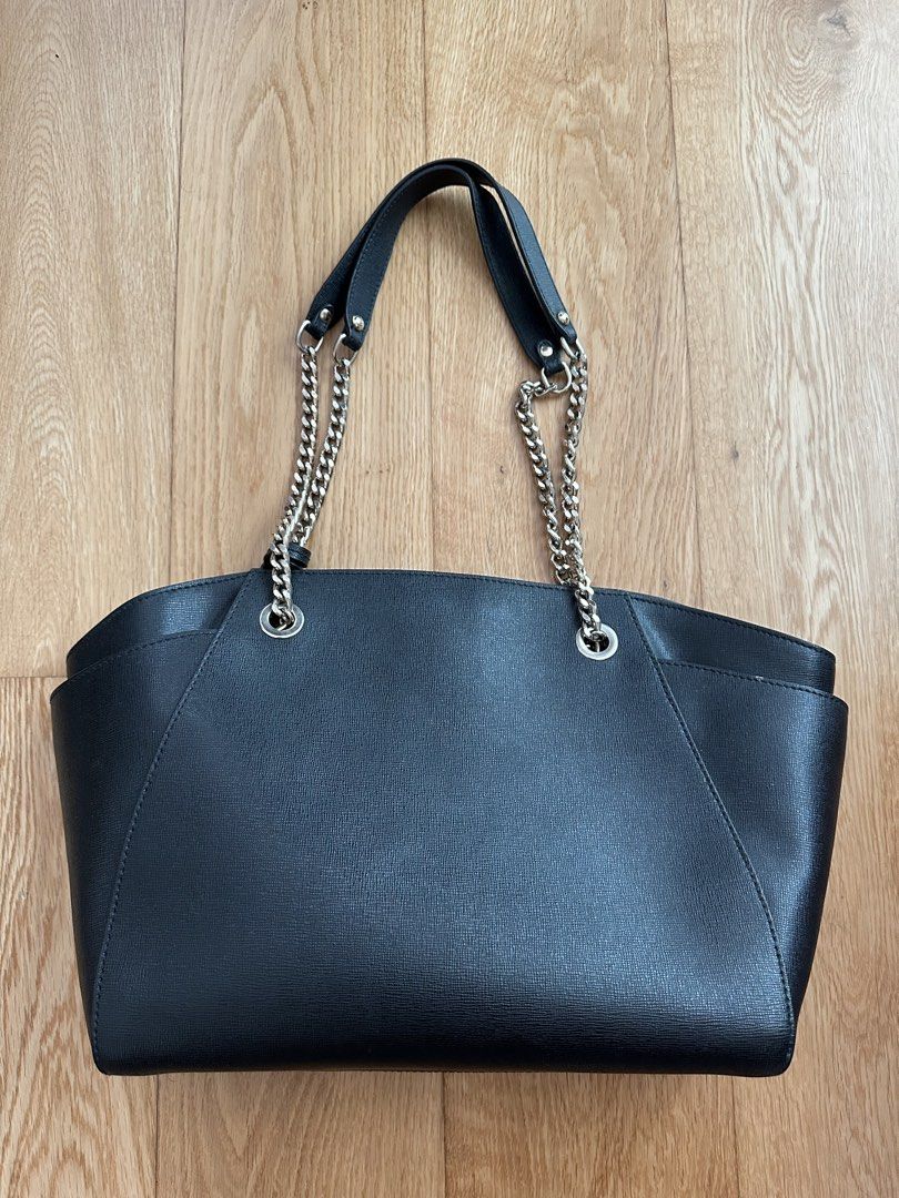 Furla Black Tote Bag with Chain Straps (Category: Luxury Bags & Wallets) located in Quezon City. Submitted by patscloset8 (Listing ID 1431574741, Image 2). Description: - Furla black tote bag - Chain straps - Magnetic closure - Spacious interior - Fabric lining with Furla logo - Interior pockets for organization - Brand new being sold at 380 USD (around 20,000 pesos) From the website: Material: Saffiano genuine leather Dimensions/Measurements: He