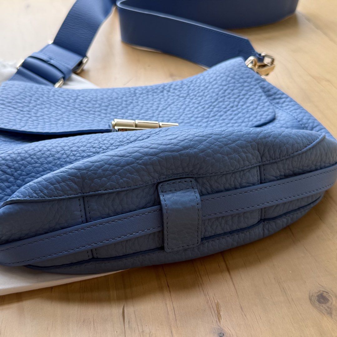 Furla Metropolis Crossbody Bag - Blue (Category: Luxury Bags & Wallets) located in Calamba. Submitted by letsygread9 (Listing ID 1431672948, Image 3). Description: - Authentic Furla Metropolis crossbody bag - Beautiful blue color - Gold-tone clasp and hardware - Includes dust bag and care card - Textured leather exterior - Adjustable strap - Clean interior - Stylish and functional.