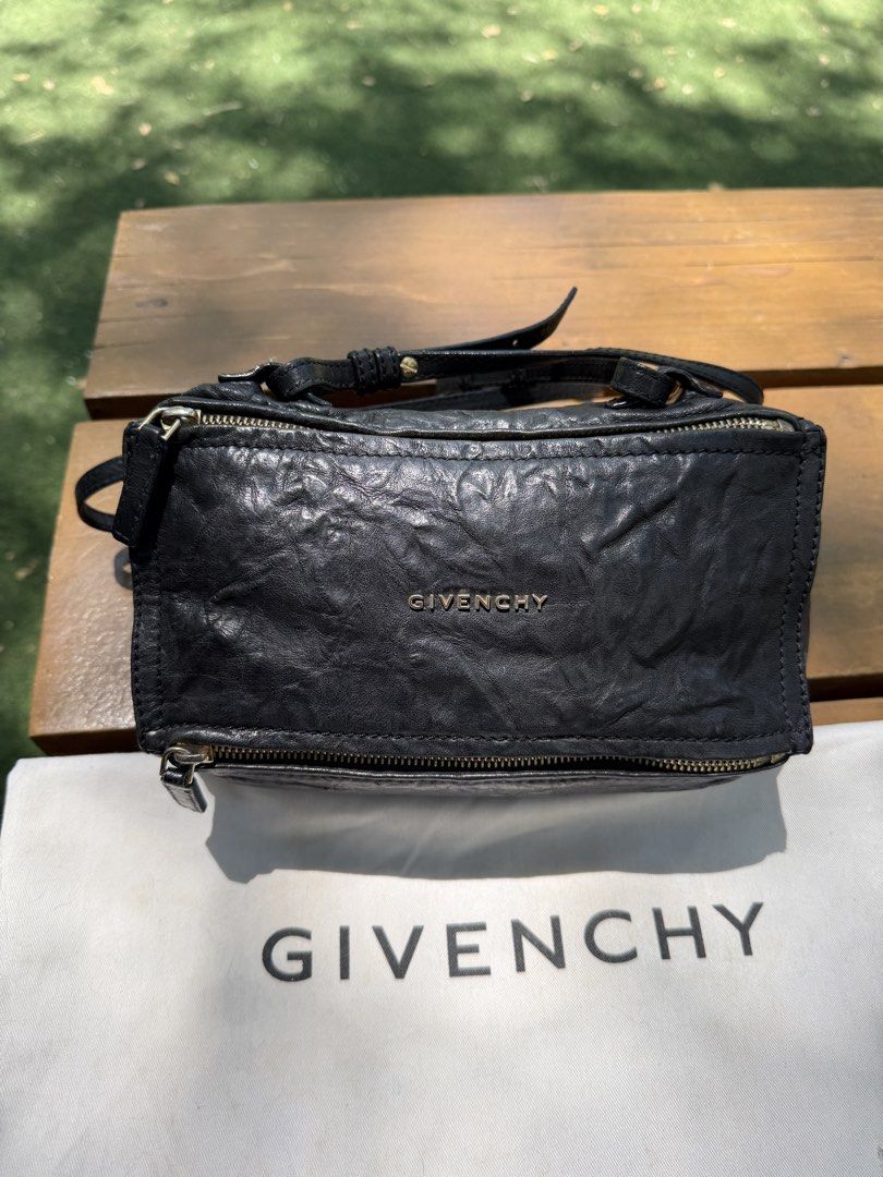 Givenchy Pandora Mini Bag (Category: Luxury Bags & Wallets) located in Makati City. Submitted by mintkitty (Listing ID 1431694642, Image 2). Description: Authentic Givenchy Pandora Bag – timeless design, luxe textured leather, and gold-tone details. Versatile crossbody or shoulder wear. • Givenchy Pandora Mini Aged Leather (with dustbag) • Material: Black leather with crinkled finish • Hardware: Gold-tone zippers and accents • Strap: Long adjusta