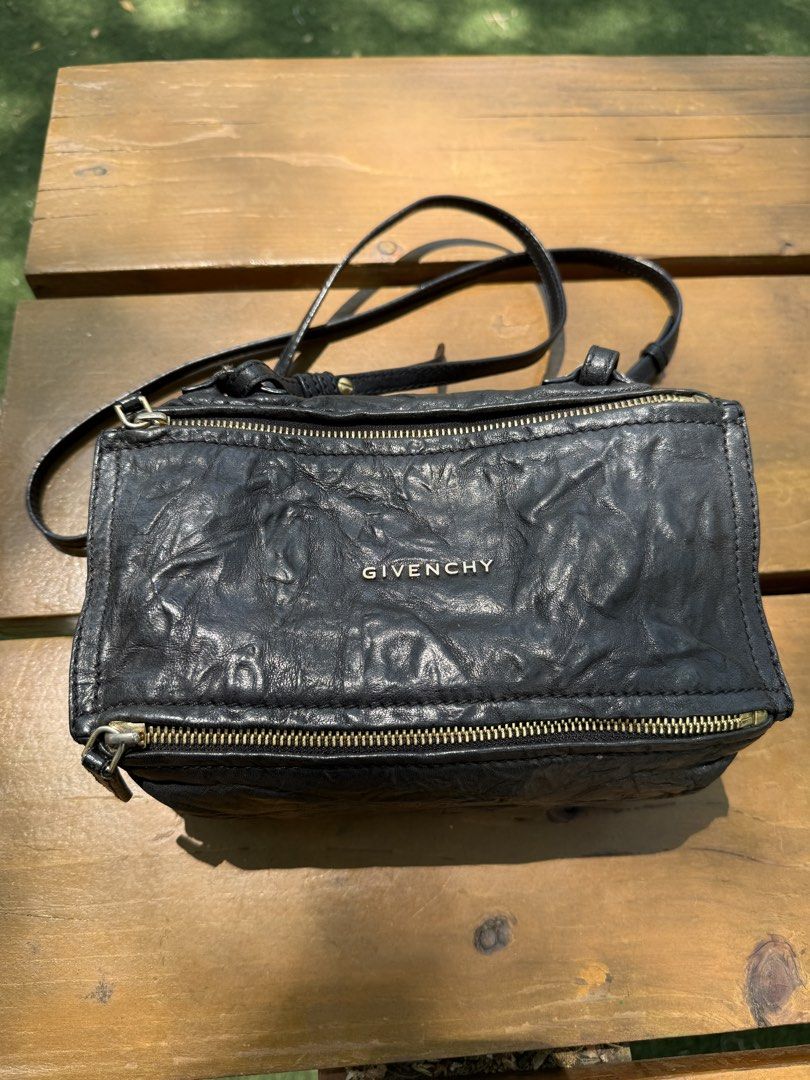 Givenchy Pandora Mini Bag (Category: Luxury Bags & Wallets) located in Makati City. Submitted by mintkitty (Listing ID 1431694642, Image 1). Description: Authentic Givenchy Pandora Bag – timeless design, luxe textured leather, and gold-tone details. Versatile crossbody or shoulder wear. • Givenchy Pandora Mini Aged Leather (with dustbag) • Material: Black leather with crinkled finish • Hardware: Gold-tone zippers and accents • Strap: Long adjusta