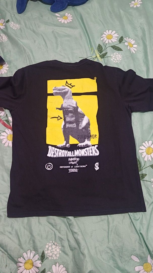 Godzilla x Peach John Dinosaur T-shirt (Category: Tshirts & Polo Shirts ) located in Manila. Submitted by weekend-thrift (Listing ID 1431683916, Image 2). Description: - Godzilla graphic t-shirt - Size: L - Features 'Destroy All Monsters' graphic on the back - Small graphic on the front - Short sleeves - Crew neck.