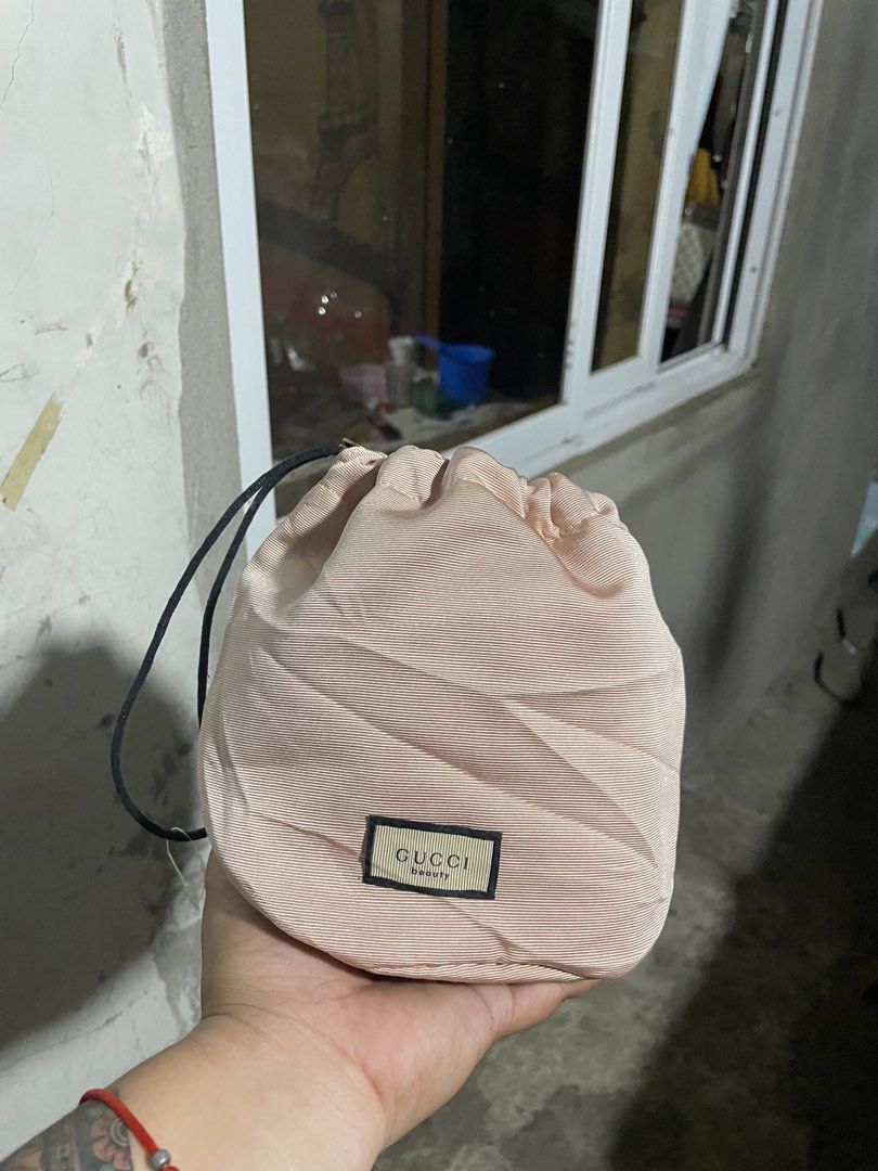 Gucci Beauty Pouch (Category: Luxury Bags & Wallets) located in Santiago. Submitted by UkayLuxxSelector (Listing ID 1431703072, Image 1). Description: - Authentic Gucci beauty pouch - Light pink exterior - Drawstring closure - Floral interior lining - Includes Gucci tag with product information - Made with 100% organic cotton and recycled polyester.