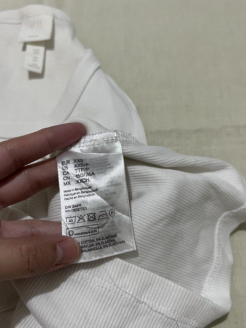H&M Basics White Ribbed Tank Top (Category: Sleeveless) located in Manila. Submitted by pabili.ph (Listing ID 1431787535, Image 3). Description: hugs your body! bery flattering!.