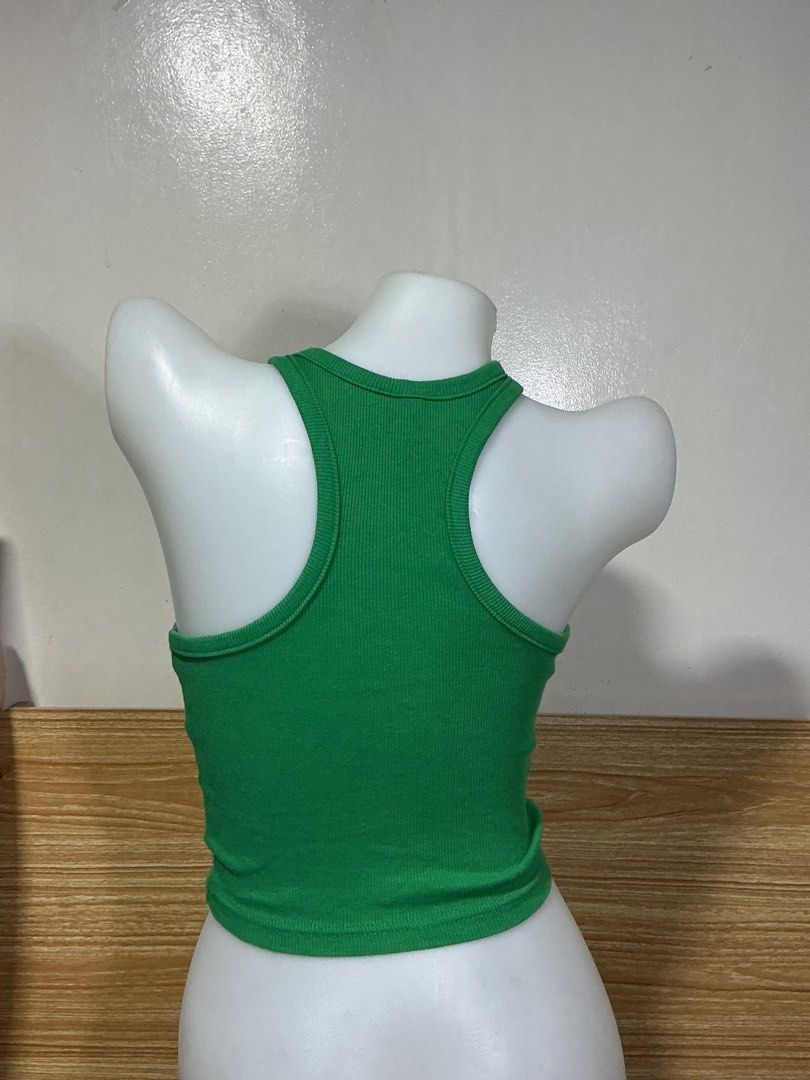 H&M DIVIDED Green Ribbed Tank Top (Category: Sleeveless) located in Mandaluyong City. Submitted by fayemaure (Listing ID 1431624583, Image 3). Description: - Green ribbed tank top - Halter neckline - Cropped style - Perfect for high-waisted bottoms - Comfortable, stretchy material - Versatile for different looks.