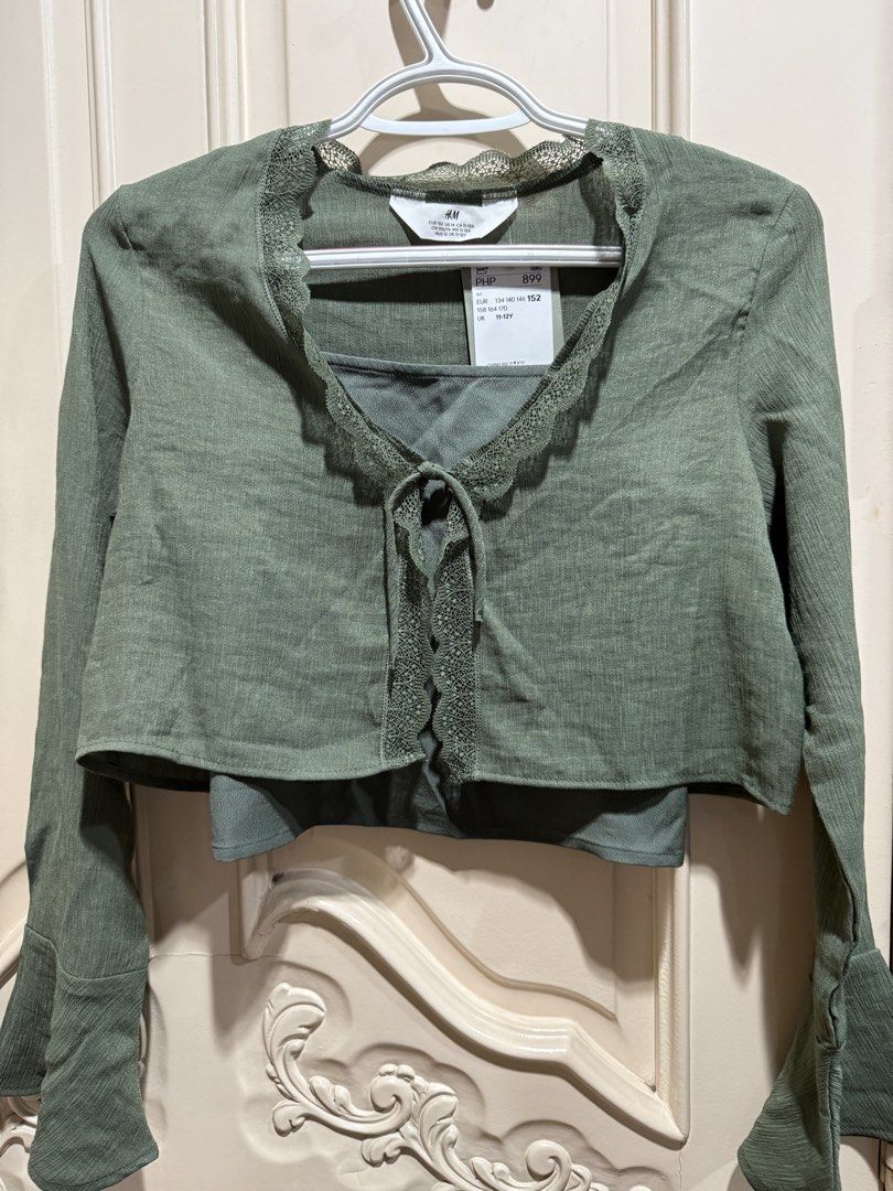 H&M Green Top and Pants Set (Category: Babies & Kids Fashion) located in Manila. Submitted by oceans18 (Listing ID 1431720878, Image 3). Description: H&M green lace top and wide-leg pants set. Size 152-158 (11-13 years old). Tie-up top, elastic waist pants. Brand new with tags..