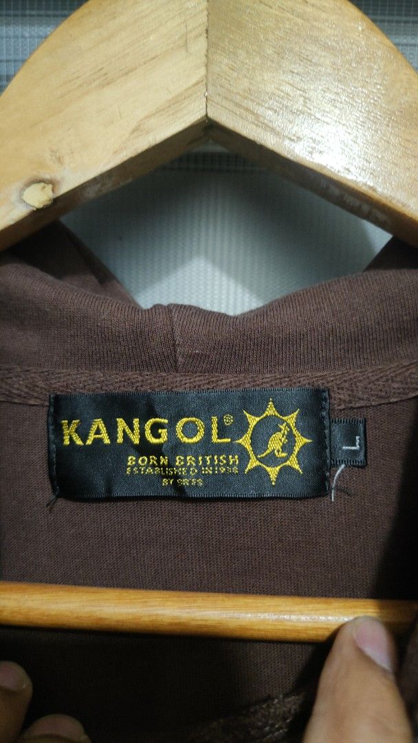 Kangol Short Sleeve Hoodie (Category: Coats, Jackets and Outerwear) located in Cavite. Submitted by trend27 (Listing ID 1431771311, Image 3). Description: - Kangol Brown Short Sleeve Hoodie - Size: Large 23/28 - Features Kangol logo on front - Brand name printed on the back - With hood - Kangaroo pocket.