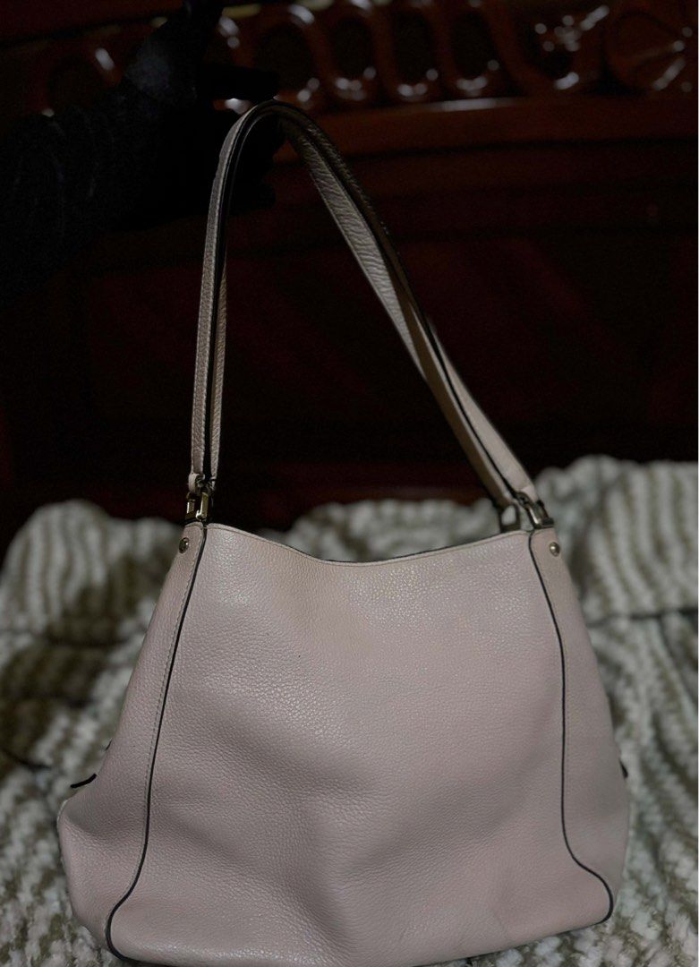 Kate Spade Leila Pink Shoulder Bag Original (Category: Luxury Bags & Wallets) located in Manila. Submitted by clearedandcherished (Listing ID 1431754722, Image 2). Description: Help me declutter! This is Kate Spade Leila in medium triple compartment shoder bag in soft pink. Features a top handle, shoulder strap, multiple compartments, and zipper closure. Gold-toned hardware. Interior with heart pattern. Includes Kate Spade New York logo. Buyer wi