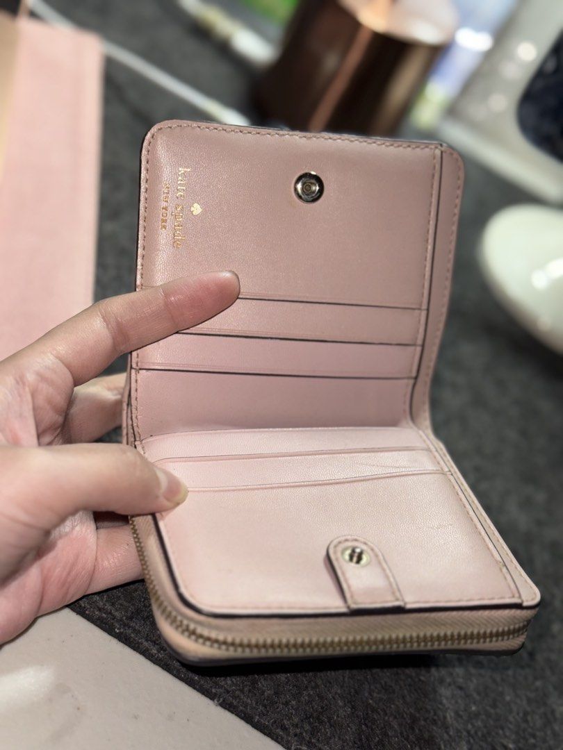 Kate Spade Natalia Small Zip Around Wallet (Category: Wallets & Card holders) located in Manila. Submitted by annchariz (Listing ID 1430059014, Image 2). Description: Kate Spade Natalia Small Zip Around Wallet 3.94’’ h x 4.25’’ w x 1.65’’ Quilted leather Two way spade jacquard lining interior: 6 credit card slots, bill fold, zip around coin compartment with a center divider exterior: id window, slip pocket snap & zip closure RFS not used anymore 
