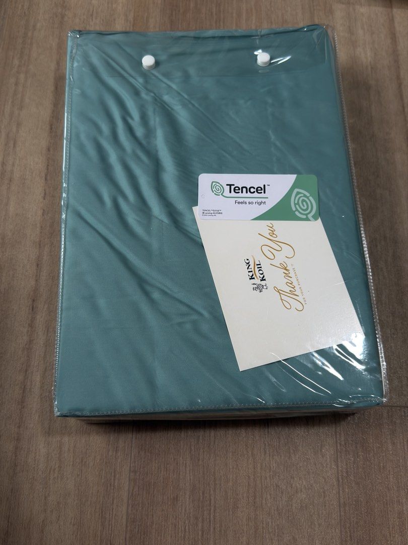 King Koil Tranquility Tencel Bed Sheet Set (Category: Bedding & Towels) located in Singapore. Submitted by smiling_216 (Listing ID 1431660852, Image 2). Description: - Brand new King Koil Tranquility Tencel bedsheet set. - King size. - Made from soft and breathable Tencel. - Still in original packaging..
