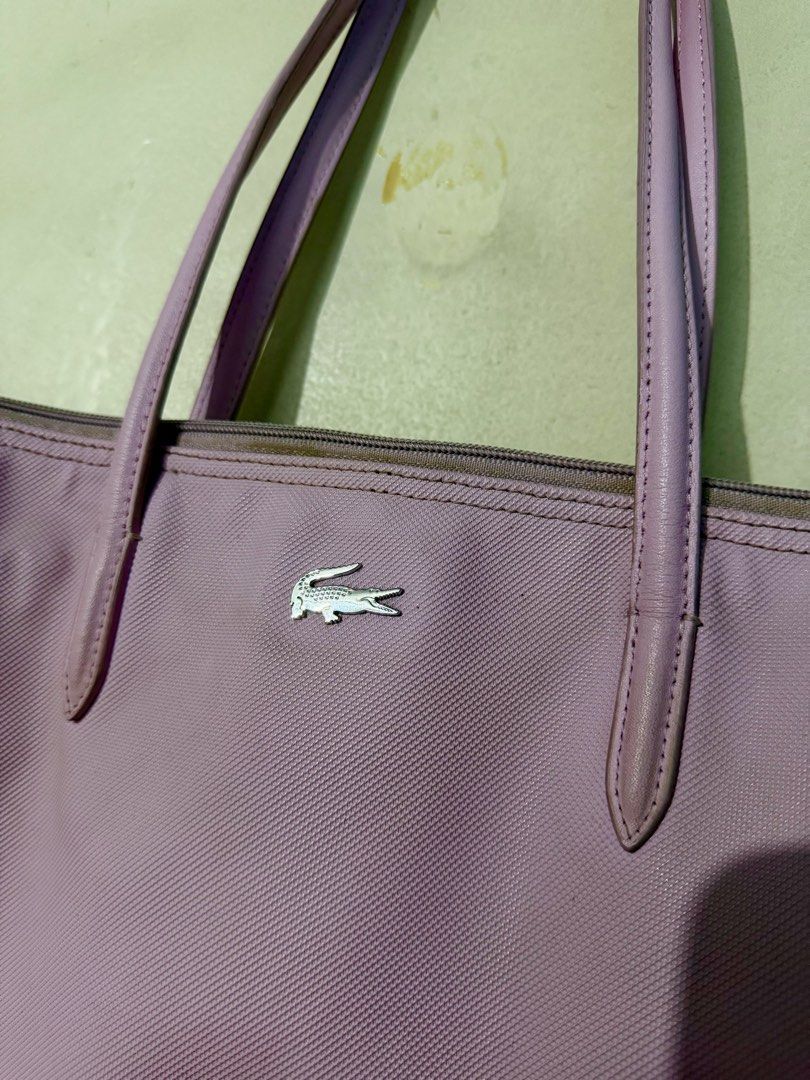 Lacoste Tote Bag (Light Pink) (Category: Tote Bags) located in Quezon City. Submitted by assdeclutters (Listing ID 1431594135, Image 2). Description: Zipper closure with classic metal Lacoste logo. Online shop bought. Well used. Slightly negotiable. .