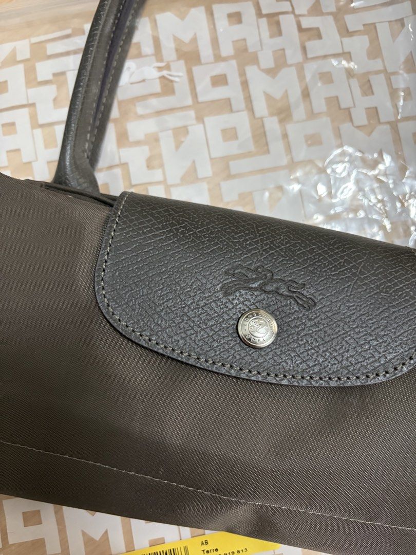 Longchamp Le Pliage Terra Medium Long Handle (Category: Luxury Bags & Wallets) located in Manila. Submitted by lovedtwice.ph (Listing ID 1431672614, Image 3). Description: Guaranteed original See photos for details of the bag No flaws or signs of usage LAST PRICE..