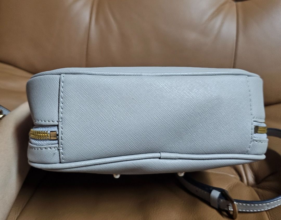 LOVCAT Paris Grey Handbag (Category: Luxury Bags & Wallets) located in Manila. Submitted by marsacovent (Listing ID 1431585952, Image 3). Description: - LOVCAT Paris handbag - Grey exterior - Top handle and detachable shoulder strap - Gold-toned zippers and hardware - Multiple interior compartments - LOVCAT logo on front.