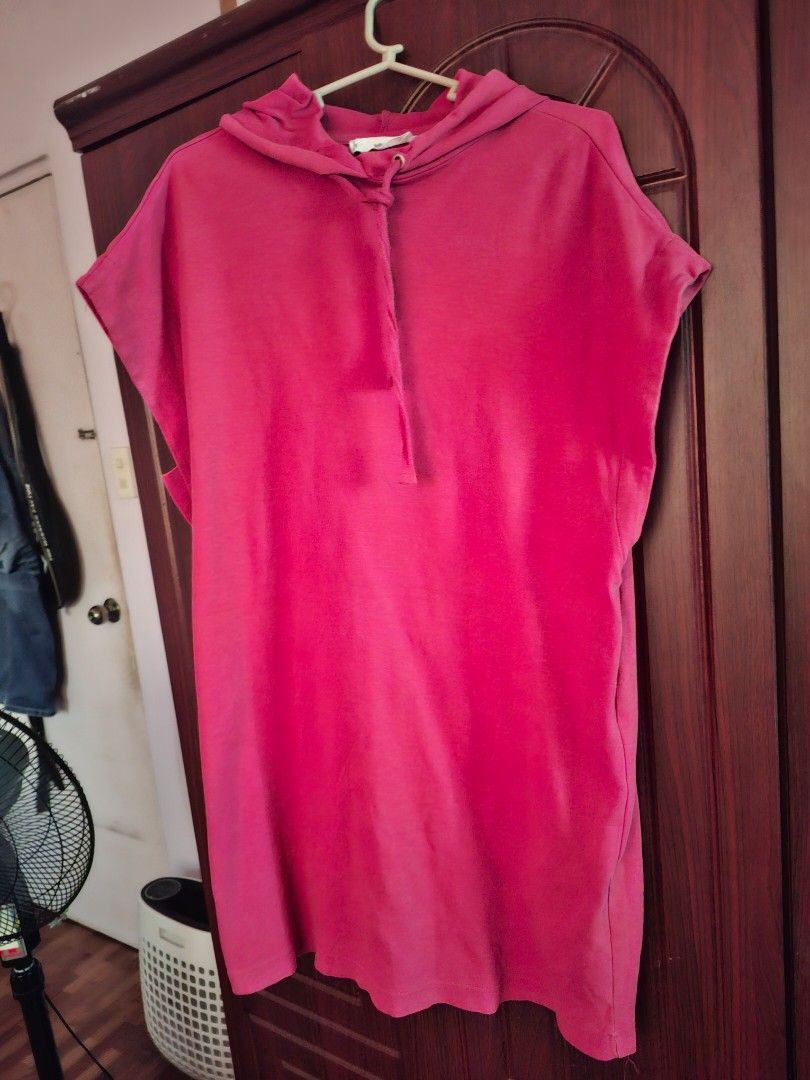 Mango Red Dress Hoodie (Category: Coats, Jackets and Outerwear) located in Cavite. Submitted by redgelu (Listing ID 1431604598, Image 3). Description: - Mango red hoodie - Simple design - Features a hood - Size tag visible in photos - Made in Bangladesh - Solid red color.