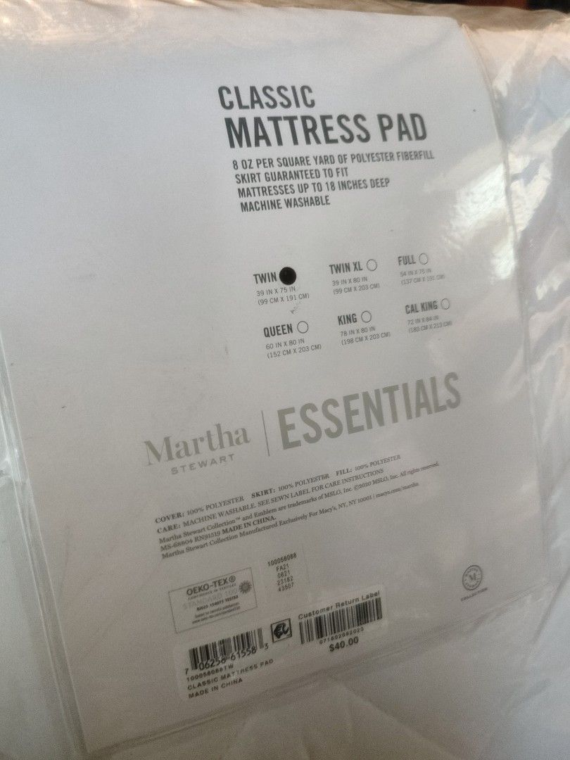 Martha Stewart Essentials Classic Mattress Pad (Category: Bed Frames & Mattresses) located in Baler. Submitted by onlyhuman_67 (Listing ID 1431619450, Image 1). Description: This is brand new. Please see dimensions. - Martha Stewart Essentials Classic Mattress Pad - Twin size (39 inches x 75 inches) - Fits mattresses up to 18" deep - Made with 8 oz per square yard polyester fiberfill - Machine washable.