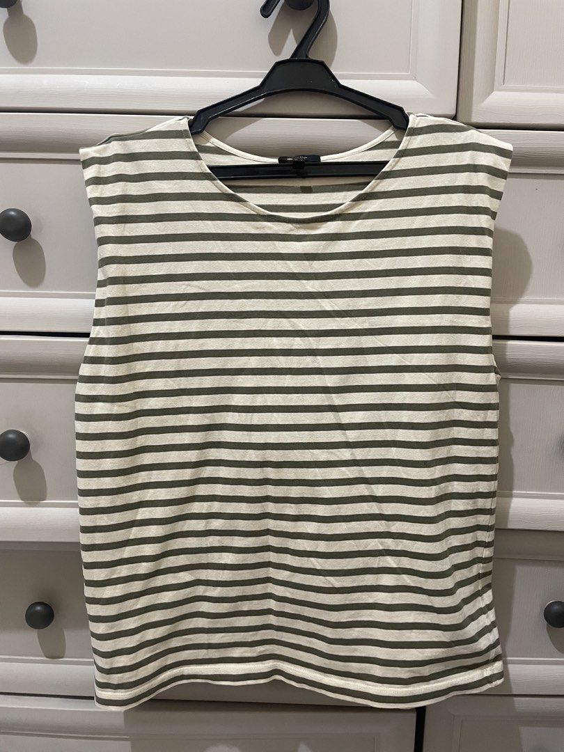 Massimo Dutti Striped Sleeveless Top - (Fits Up To Medium) (Category: Sleeveless) located in Makati City. Submitted by thingsoncelovedph (Listing ID 1431756948, Image 1). Description: - Massimo Dutti sleeveless top - Size: XS but fits up to Medium - Design: Classic striped pattern - Color: White and olive green stripes - Neckline: Round - Fit: Relaxed - Made in Morocco - Suitable for various occasions.