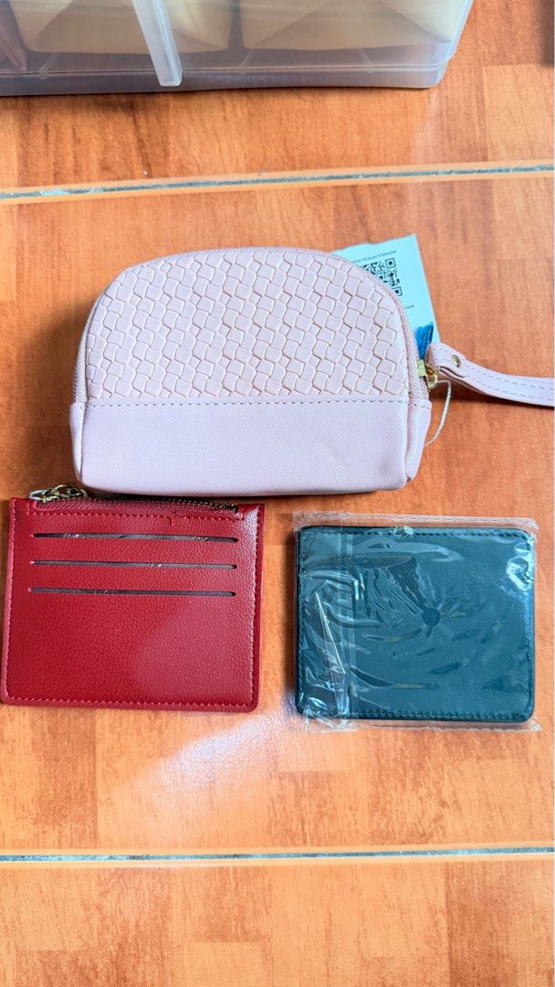 Michaela Wallet and Pouch Set (Category: Wallets & Card holders) located in Makati City. Submitted by assorted_items88 (Listing ID 1431597554, Image 2). Description: 🎁 FOR SALE: Michaela Set (3 pcs – Brand New) ✔️ Original Michaela ✔️ BRAND NEW / unused ✔️ Includes: • 1 Pink pouch (with wrist strap) • 1 Red card holder • 1 Green card holder (sealed) ✔️ Perfect for daily use / gifting ✔️ Compact and stylish Condition: 10/10 – all unused RFS: Decl
