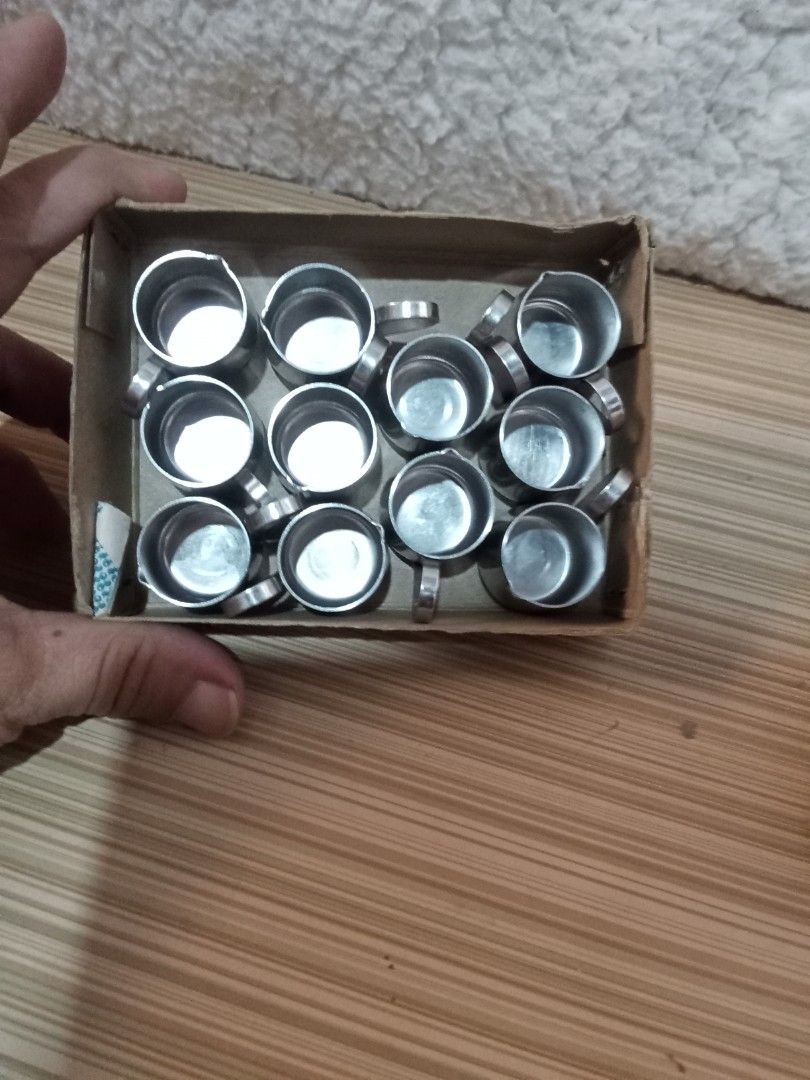 Miniature Stainless Steel Cups (Category: Coffee & Tea Tableware) located in Bocaue. Submitted by marajapansurplus (Listing ID 1431602062, Image 1). Description: - Set of miniature stainless steel cups - Each cup has a small handle - Comes in a cardboard box with Japanese text - Cups appear unused - Ideal for small servings or decorative use.