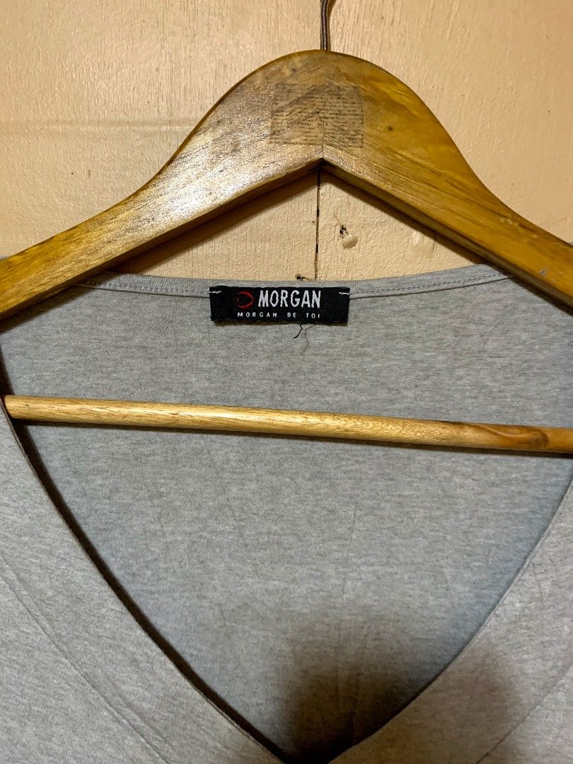 Morgan De Toi V-Neck Top (Category: Sleeveless) located in Bislig. Submitted by styleeee (Listing ID 1431609975, Image 2). Description: - small-medium - Morgan brand - V-neck design - Three-quarter sleeves - Light gray color.