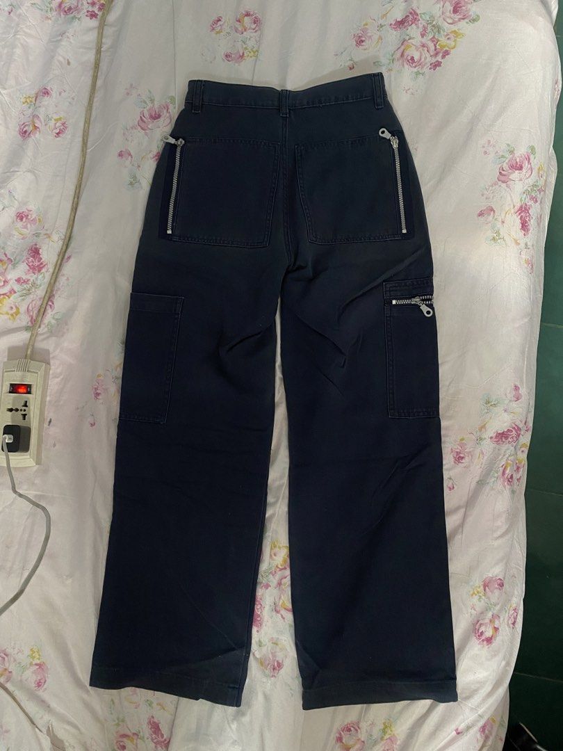 Navy Blue Cargo Pants with Zippers (Category: Other Bottoms) located in General Trias. Submitted by erssss22 (Listing ID 1431713978, Image 3). Description: - Navy blue cargo pants -size 24-25 Length 37 - Wide-leg design - Multiple zippered pockets - Classic cargo style - Button and zipper closure - Unique zipper accents - Perfect for casual wear.