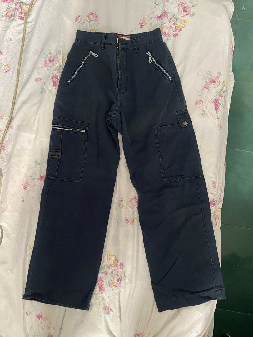 Navy Blue Cargo Pants with Zippers (Category: Other Bottoms) located in General Trias. Submitted by erssss22 (Listing ID 1431713978, Image 2). Description: - Navy blue cargo pants -size 24-25 Length 37 - Wide-leg design - Multiple zippered pockets - Classic cargo style - Button and zipper closure - Unique zipper accents - Perfect for casual wear.