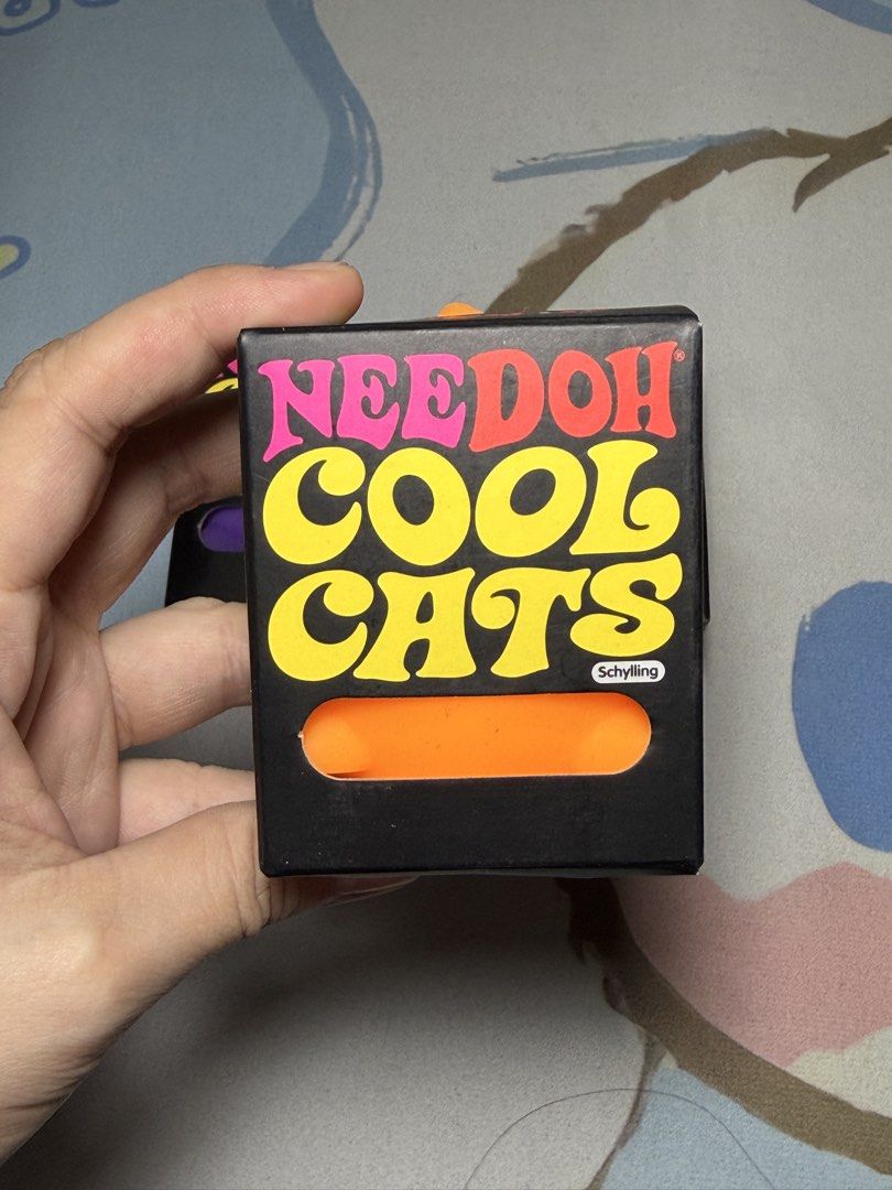 NeeDoh Cool Cats Stress Ball (Category: Kids Toys) located in Davao. Submitted by maezes.online.store (Listing ID 1431720479, Image 2). Description: - NeeDoh Cool Cats stress ball - Cat-shaped design - Filled with a squishy gel - Suitable for ages 3+ - Made by Schylling - 'Purrfect Way to Mellow Out!'.