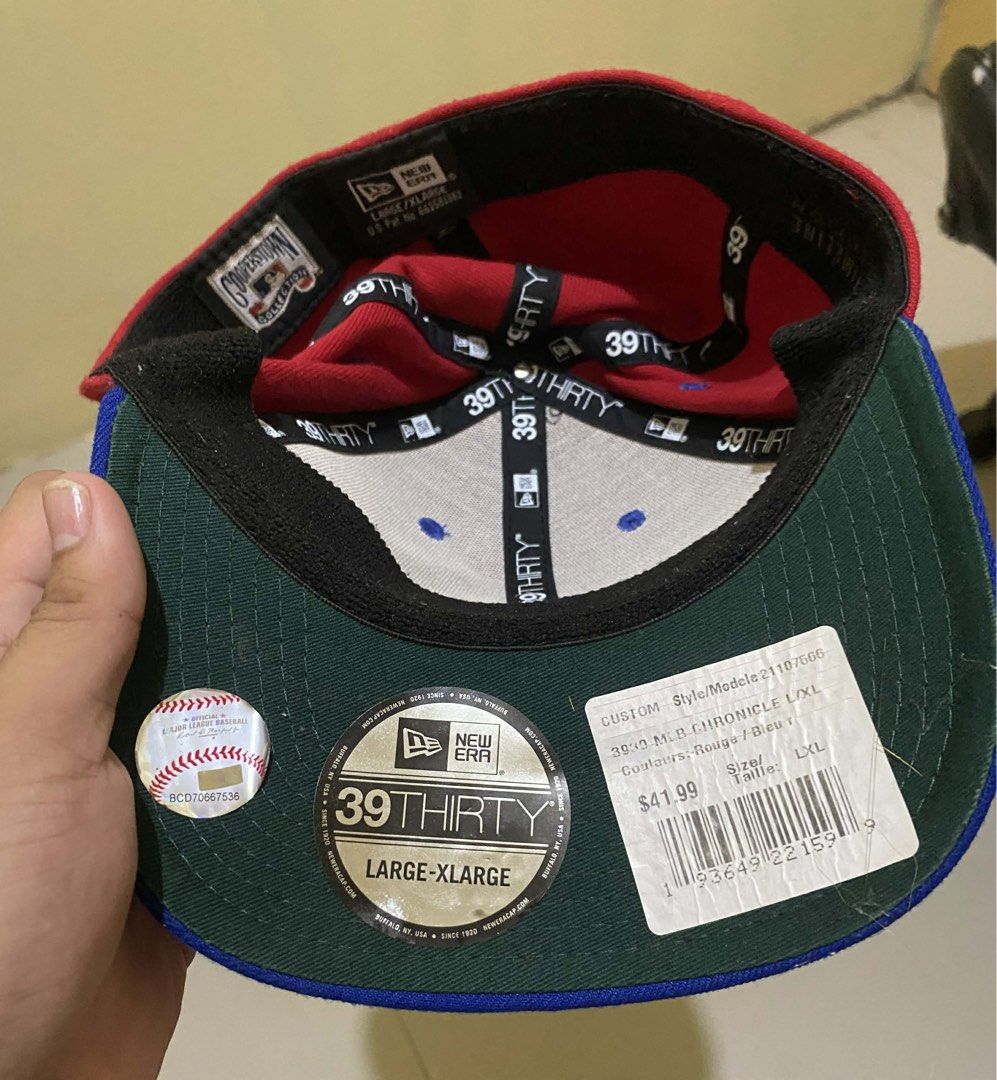New Era Toronto Blue Jays MLB Cap (Category: Caps & Hats) located in Manila. Submitted by kathhhhh236 (Listing ID 1431759754, Image 2). Description: - Toronto Blue Jays cap - 39THIRTY style - MLB Timeline Collection - Red crown, blue brim - Size: Large/XLarge - Era: 1997-2002.