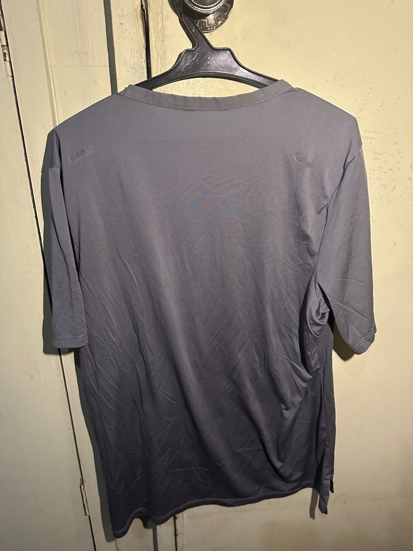 Nike Running Dri-FIT ADV Gray T-shirt - Medium (Category: Activewear) located in Manila. Submitted by nuggs267 (Listing ID 1431767486, Image 2). Description: Nike Running Dri-FIT ADV gray t-shirt. Features a crew neck and short sleeves. Made of 100% polyester. Size M. The shirt has the Nike logo on the front and the "Nike Running" label on the collar. Made in China. Slightly used Rfs: too small for me.