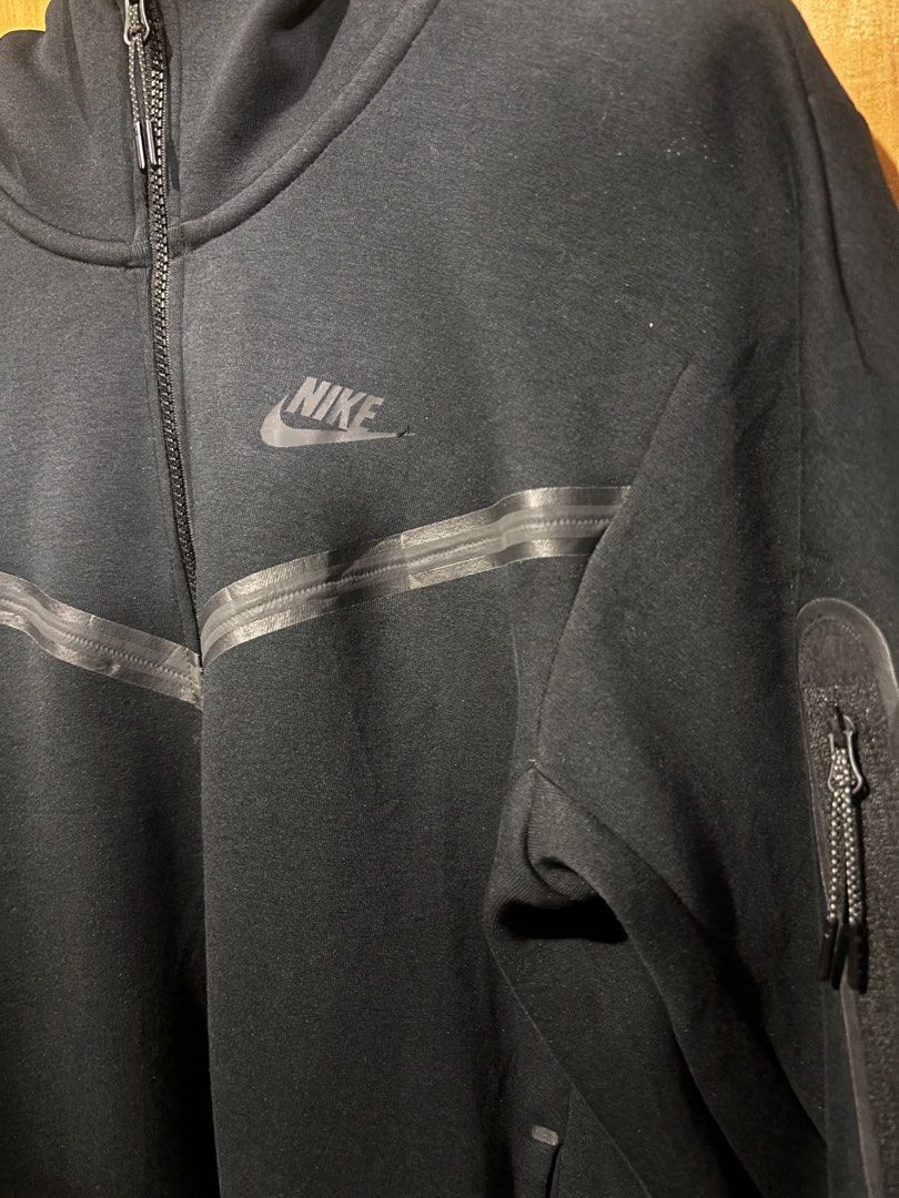 Nike Tech Fleece Full-Zip Hoodie (Category: Coats, Jackets and Outerwear) located in Manila. Submitted by cench. (Listing ID 1431695212, Image 2). Description: - Nike Tech Fleece hoodie - Black color - Size: S - Full-zip closure - High collar - Side zip pockets - Nike logo on chest - Made in China - NO ISSUE EXCELLENT CONDITION 20x26 dimensions 2k.