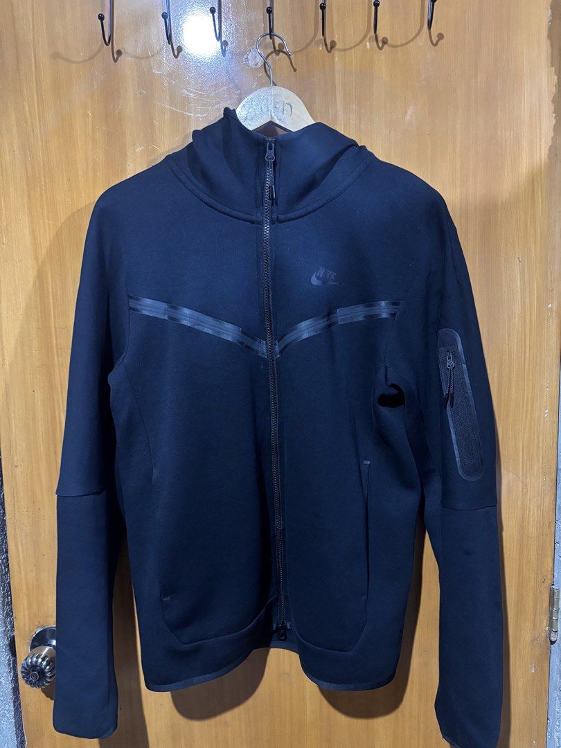 Nike Tech Fleece Full-Zip Hoodie (Category: Coats, Jackets and Outerwear) located in Manila. Submitted by cench. (Listing ID 1431695212, Image 1). Description: - Nike Tech Fleece hoodie - Black color - Size: S - Full-zip closure - High collar - Side zip pockets - Nike logo on chest - Made in China - NO ISSUE EXCELLENT CONDITION 20x26 dimensions 2k.